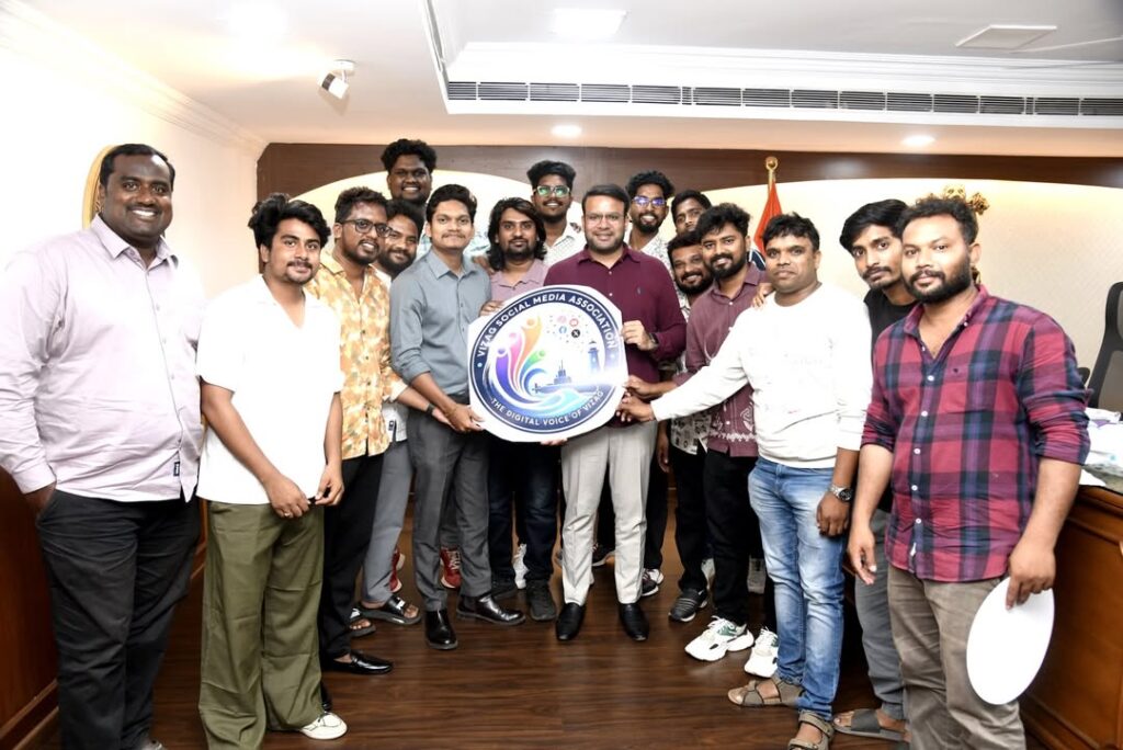 GVMC Commissioner Ketan Garg IAS unveiling Vizag Social Media Association logo with creators