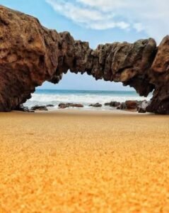 Natural rock arch and scenic coastline at Mangamaripeta Beach near Vizag