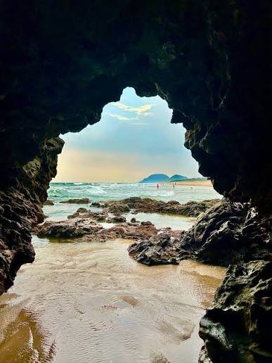 Scenic view of Seethapalem Beach with rock formations and sea caves near Vizag