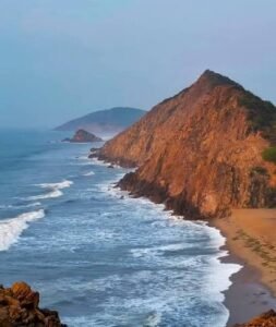 Scenic view of Gangavaram Beach with palm trees and coastline near Vizag Steel Plant