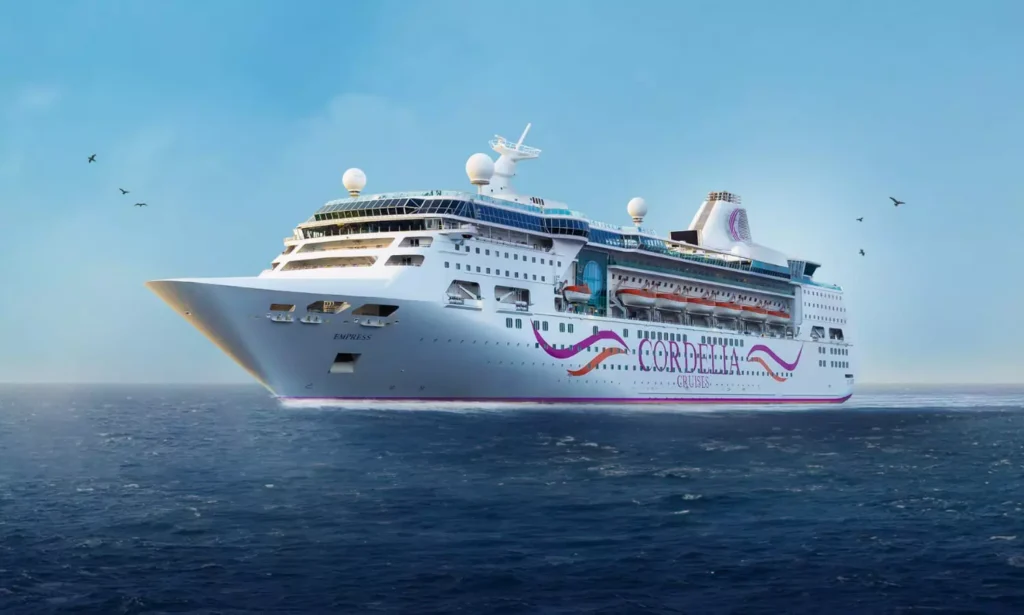 Cordelia Cruises luxury cruise sailing from Visakhapatnam with passengers enjoying onboard entertainment and sea views.